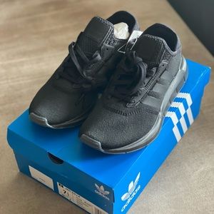 Women size 7.5 Adidas Swift Run X W in black. NWT.
